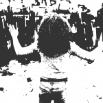 Stencil of a black woman stands in the foreground, back to the camera and hands up. She faces a line of police officers in riot gear